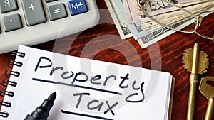 Property tax written in a notebook.