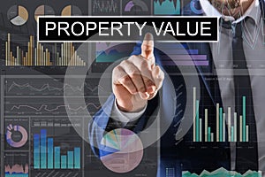 Property value. Businessman using virtual screen