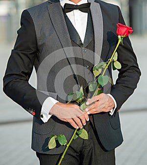 proposal concept. cropped view of black tux man making a proposal. man before marriage proposal
