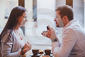 Proposal, engagement in cafe