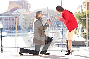 Proposal of man asking marry to his girlfriend photo