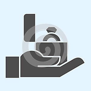 Proposal solid icon. Ring in box on hand, man offering marriage for lady. Wedding asset vector design concept, glyph