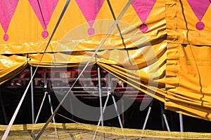 Propped up side of a circus tent photo