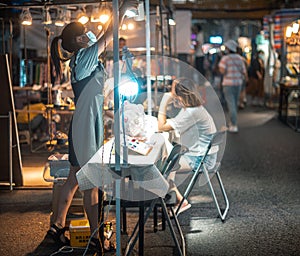 Proprietress in the night market, Wuhan, China