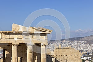 Propylaia, monumental ceremonial gateway to the Acropolis of Athens, Greece. Aerial view of the city in the distance