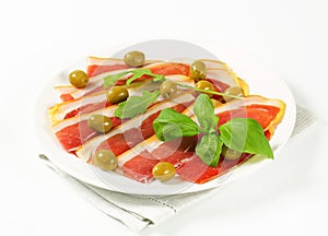 Prosciutto crudo with green olives