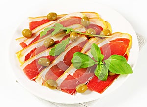 Prosciutto crudo with green olives