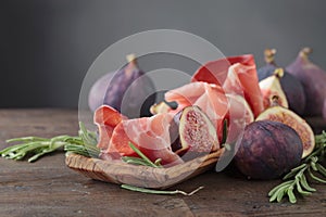 Prosciutto with figs and rosemary.
