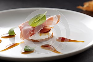 Prosciutto and goat cheese appetizer on a plate