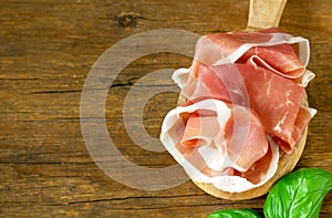 prosciutto ham on a wooden board