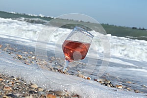 Proseco. Glasses with Proseco on a beach with seashells