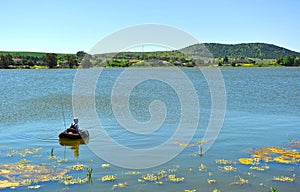 Fisherman in the dam of Proserpina, province of Badajoz, Spain photo