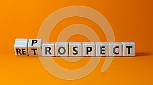 Prospect or retrospect symbol. Turned a cube and changed the word `retrospect` to `prospect`. Beautiful orange background.