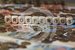 Prosperous - cube with letters, money sector terms - sign with wooden cubes