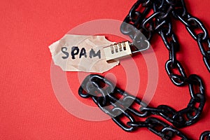 Protect from junk mail or spam e-mail and unsolicited letter. Inscription on a piece of paper and a chain with a lock