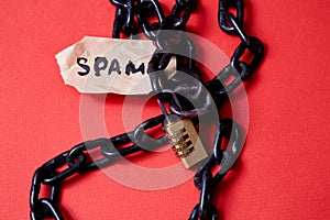 Protect from junk mail or spam e-mail and unsolicited letter. The word spam and the lock on the chain