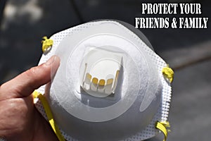 Protect Your Family & Friends With N95 Respirator In Hand Close Up High Quality