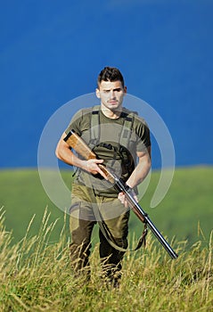 Protecting borders of motherland. Stop illegal immigrants. Man with weapon military clothes in field nature background