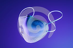 Protecting Face Mask on Violet Background Illuminated With Neon Light. Protection Against Coronavirus. 3d Rendering. photo