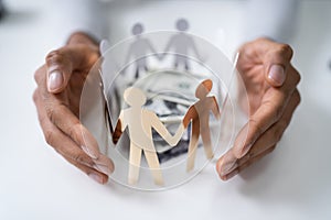 Protecting Stacked Banknotes Surrounded By Human Figures