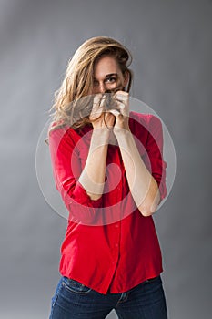 Protection concept for adorable young woman playing with her hair