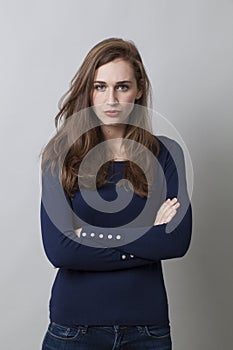 Protection concept for displeased young woman photo