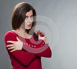 Protection concept for offended 30s woman with arms crossed