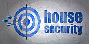 Protection concept: target and House Security on wall background