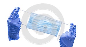 Protection face mask and blue nitrile surgical gloves isolated on white background. Medical concept