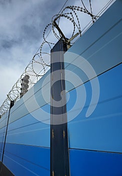 Protection fence with barbed wire for surface subway protection