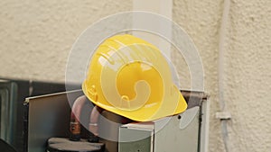Protection helmet on air conditioner
