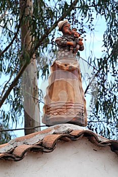 protection house peruvian ceramic with woman