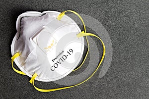 Protection mask from Coronavirus.  COVID-19 protective mask on a stone background. Personal protection equipment against viruses