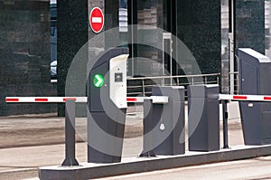 The protective barrier and security office at the entrance to the office parking lot