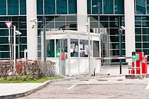 The protective barrier and security office at the entrance to the office parking lot