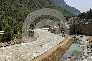 Protective boundary wall built against a high flood water in the river to prevent damages to the road and houses at bahrain swat