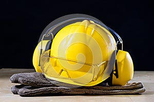 Protective clothing and tools lying on the workshop table. Buy a photo