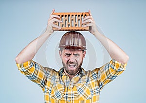 Protective equipment. mature builder in shirt. unshaven man on construction site. handsome building worker in hard hat