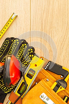 Protective equipment and tools in a bag for a builder