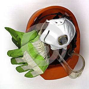 Protective equipment work helmet gloves goggles and respirator on the white background