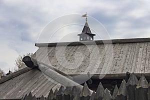 A protective fence made of logs with sharp upper ends, used in ancient Russia to protect against enemies