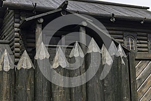 A protective fence made of logs with sharp upper ends, used in ancient Russia to protect against enemies.