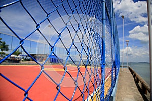 Protective fence on sports court