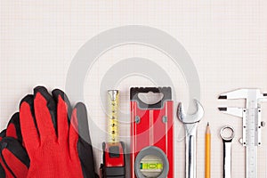 Protective gloves, measuring instruments and wrenches.