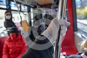 Protective gloves in public transport in Prague - coronavirus protection