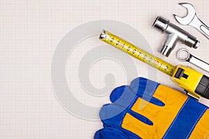 Protective gloves,  wrenches and  tape measure.