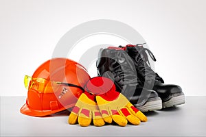 Protective helmet, boots, gloves and glasses.