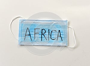 Protective medical mask with inscription Africa. Epidemia in Africa. Wuhan Coronavirus, 2019-nCoV photo