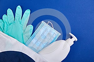 Protective medical mask, sanitizer gel and gloves in white bag