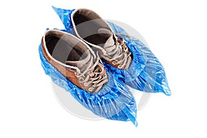 Protective shoe covers on men`s shoes